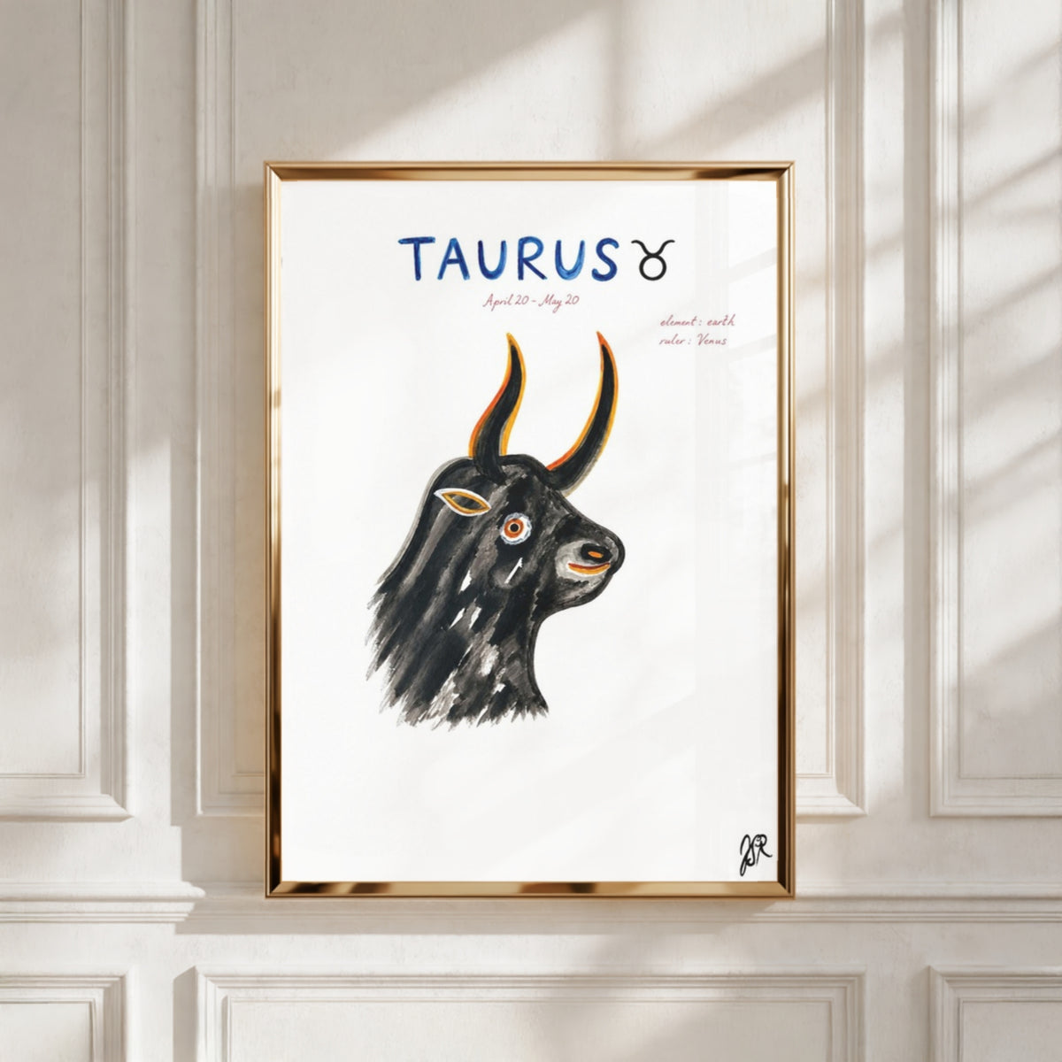 Taurus i ram - inramad tavla med text på väggen